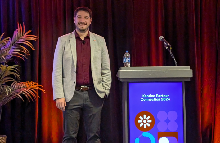 Dominik Pinter on the stage at Kentico Connection Miami 2024 for the keynote presentation